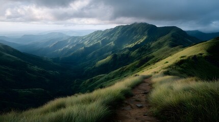 Obraz premium A winding mountain path through green hills during golden hour with dramatic lighting and atmospheric clouds