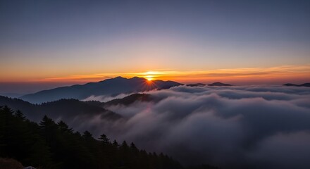 Obraz premium Sunset over misty mountain peaks. (1)
