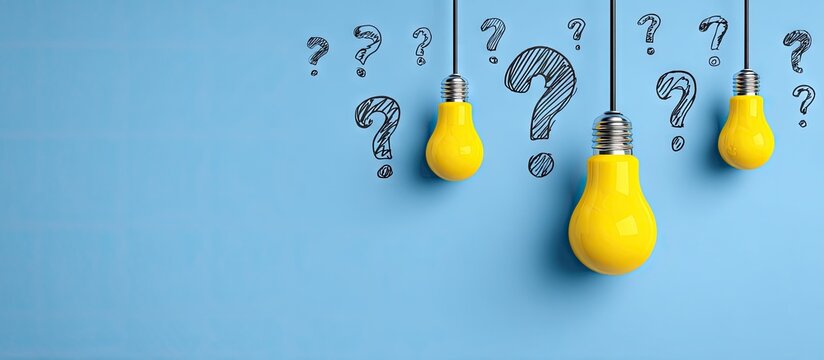 Bright yellow light bulbs hanging against a pale blue background, surrounded by question marks