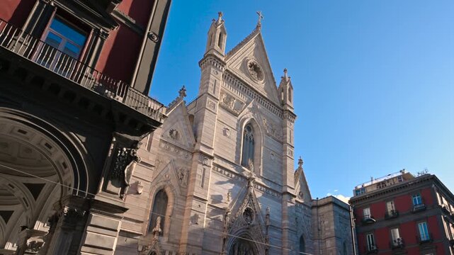 Naples, Italy, December 27, 2024. Footage of the facade of the Duomo di Santa Maria Assunta. Zoom in on the facade. Beautiful sunny day, travel destinations.