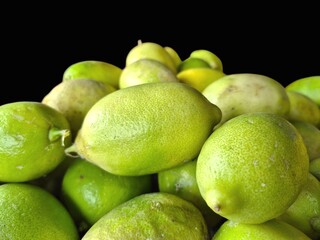 Fresh Citrus Fruits on a Black Background