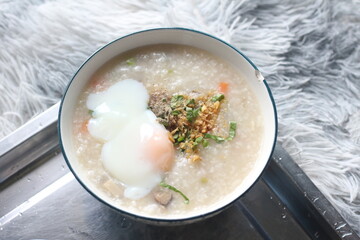Delicious egg porridge in a ceramic cup