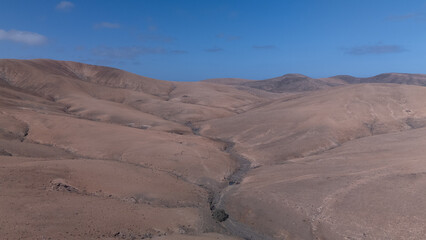 Aerial View of Desert Reservoir and Dam Structure in Arid Mountainous Landscape