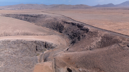 Aerial View of Desert Reservoir and Dam Structure in Arid Mountainous Landscape