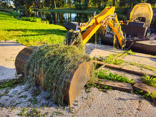 excavator's bucket was covered in algae