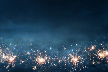 Sparkling fireworks on dark blue background festive celebration night