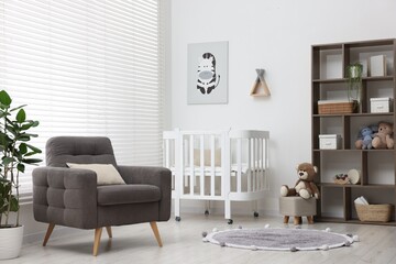 Baby's room with crib and armchair. Interior design