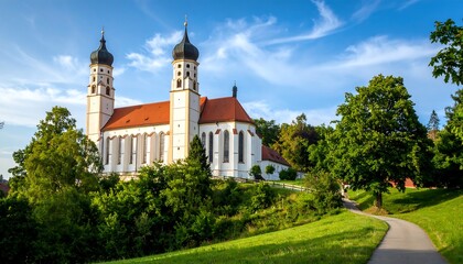 Picturesque church nestled in lush greenery under a vibrant sky