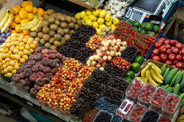 Top view of fresh raw vegetables and fruits on a market.