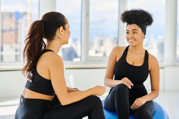 Engaging moments during a pilates session among young women