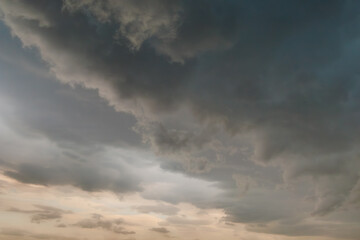 Dark storm clouds gathering in evening sky