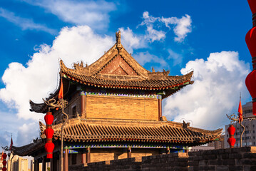 Traditional building and red lanterns on old wall in Xian, China