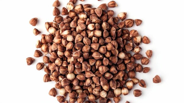 Close-up of whole cumin seeds, brown and crinkly surface texture