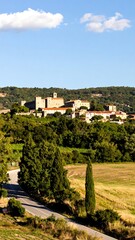 Picturesque hilltop village nestled in rolling hills