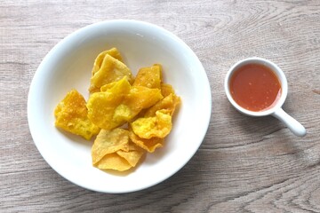 crispy fried dumpling paste stuffed chop pork and shrimp dipping sweet chili sauce on bowl