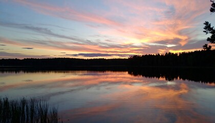 Fototapeta premium Serene sunset over a lake