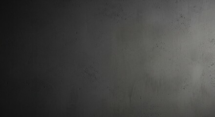 A dark gray textured surface with subtle variations in tone and small scattered imperfections visible throughout