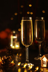 Two glasses with champagne in New Year Eve and Christmas style