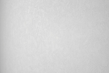 It is a close-up of white wallpaper.