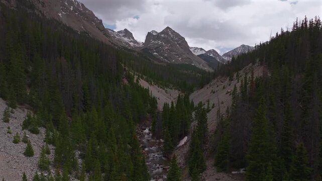 Huerfano River valley Blanca Peak Mt Mount Lindsey Lily Lake trail Sangre de Cristo Range Colorado aerial drone spring Summer San Isabel forest Iron Nip ple Rocky Mountains gray clouds forward pan up