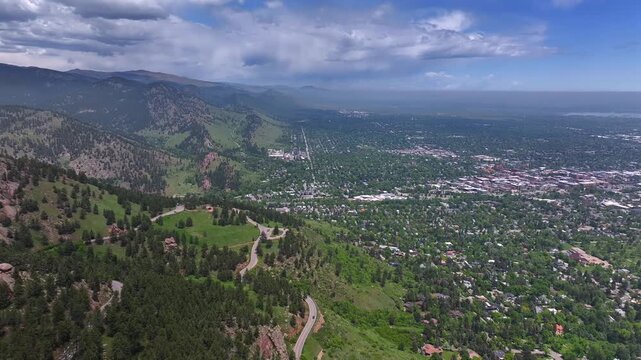 Front range town of Boulder Colorado summer spring aerial drone Chautauqua Park Flatirons Green mountain Pearl Street Mall Eben G Fine Park Boulder creek college University blue sky sunny clouds right
