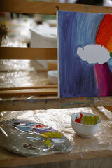 artist painting on canvas