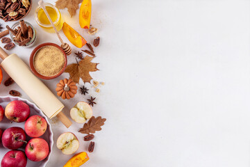 Fall baking, cooking seasonal dessert background with various ingredients - honey, pumpkin squash,...