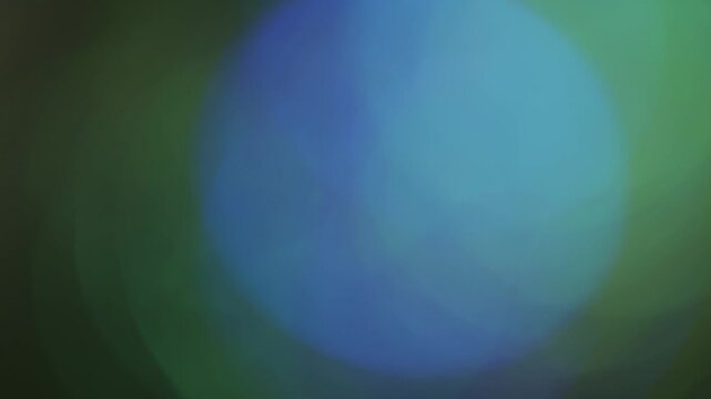 Green bokeh light background with soft blur and glowing particles. Ideal for overlays, abstract video projects, dreamy atmospheres, and creative motion design.