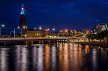 Fototapeta premium Stockholm City Hall Illuminated at Night with Reflections