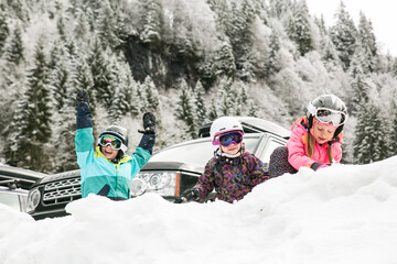 family having fun in the snow