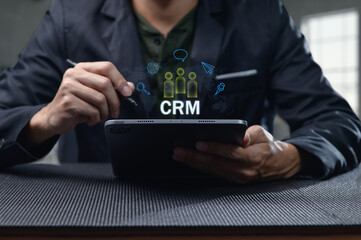 Professional Using Tablet for Customer Relationship Management Insights