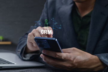 Business Professional Engaging with CRM Application on Mobile Device