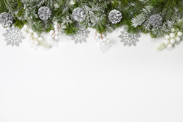 Christmas card with fir branches and Christmas decorations