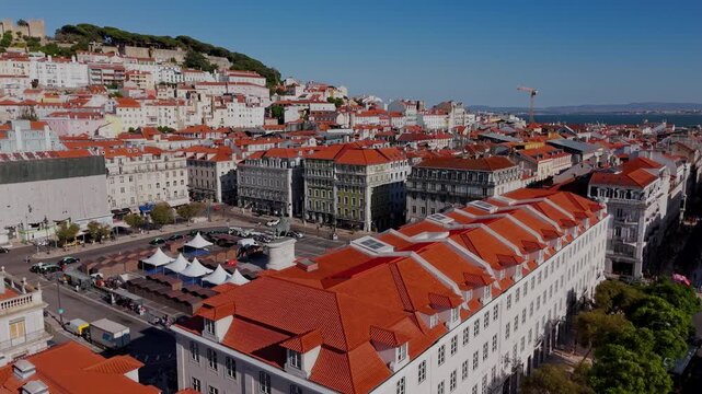 Lisbon Drone Pull Away from Praca da Figueira to Rossio Square with Fountains and Column