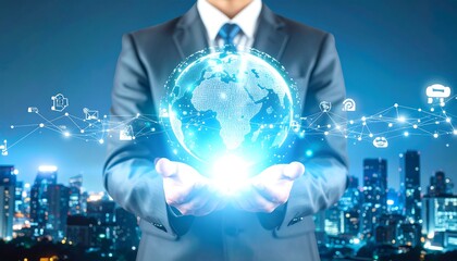 Businessman holds glowing digital globe over cityscape at night