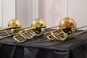 Trombones lying on stage close-up 
