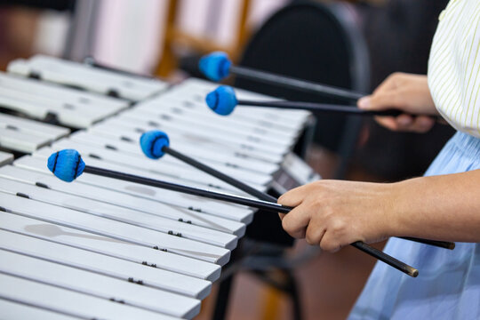 Hands of a girl playing the vibraphone