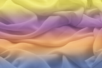 Nahaufnahme von einem weichen Stoff mit Farbverlauf von gelb, lila, rosa, orange und blau