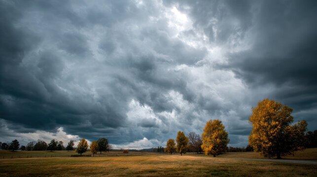 A dramatic autumn sky with clouds rolling in, creating a cozy, atmospheric fall day.