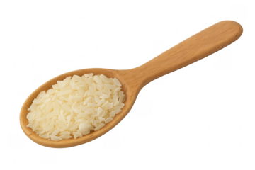 Wooden spoon holding dry rice grains on transparent background