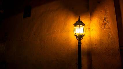 street lights shining dimly at night in Kajoetangan village