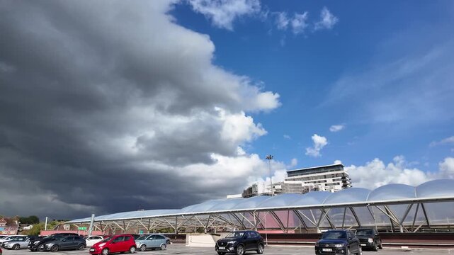 Basingstoke Hampshire England UK 03.09.2025. Video. Storm clouds gather over Basingstoke town centre seen from roof of a multi storey car park.
