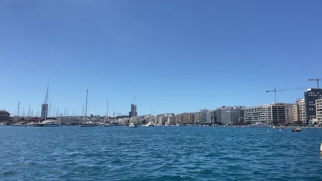 Riding the boat between Silema and Valetta overlooking cathedral