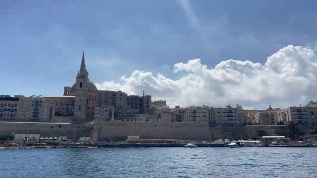 Riding the boat between Silema and Valetta overlooking cathedral