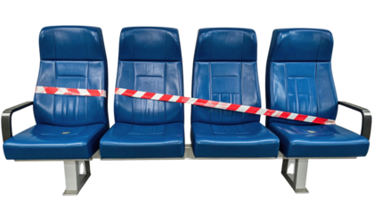 Four connected blue padded seats with armrests, sealed off by red-and-white caution tape stretched across the row.