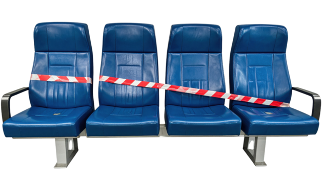 Four connected blue padded seats with armrests, sealed off by red-and-white caution tape stretched across the row.