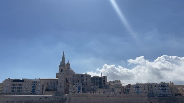 Riding the boat between Silema and Valetta overlooking cathedral