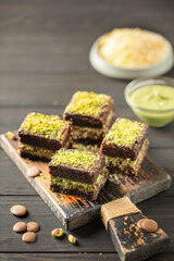 Trend dessert. Dubai Brownies. Chocolate muffin with a layer of pistachio paste and kataifi dough