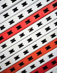 Abstract Pattern of Red and White Slotted Angle Bars