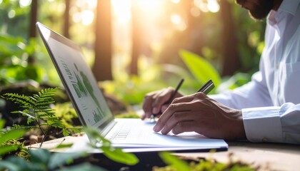 Person working outdoors with laptop